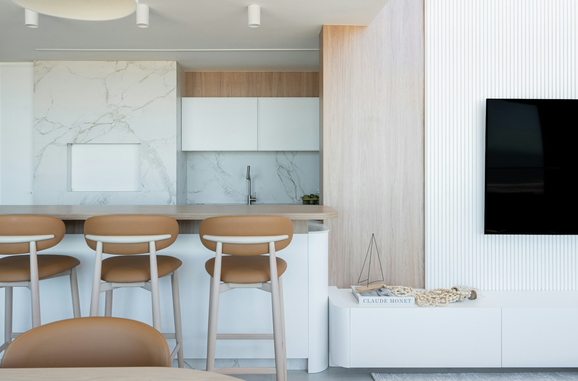 A bright modern kitchen and living area